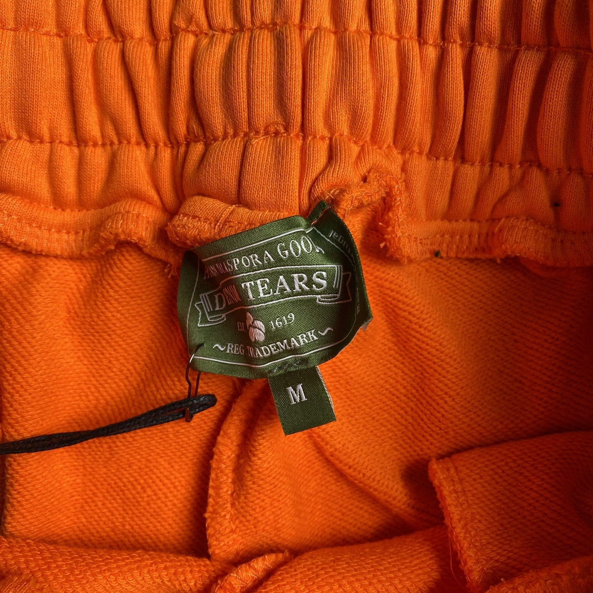 DENIM TEARS COTTON WREATH SWEATPANTS ORANGE - netstar