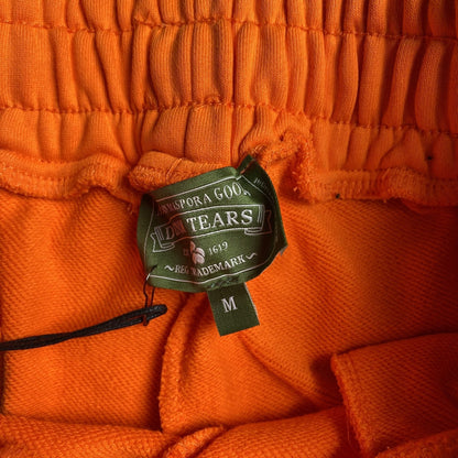DENIM TEARS COTTON WREATH SWEATPANTS ORANGE - netstar